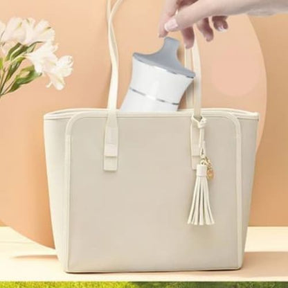 Chauffe biberon portable voyageur dans sac à langer