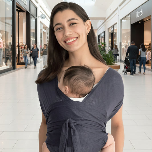 Écharpe porte bebe aisance dans centre d'achat