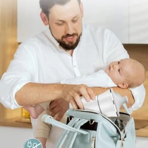 Papa range chauffe biberon portable voyageur dans sac à langer