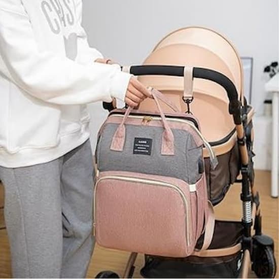 Sac à dos à langer ergonomique rose sur poussette