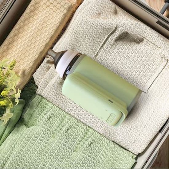 chauffe biberon nomade universel compact dans valise